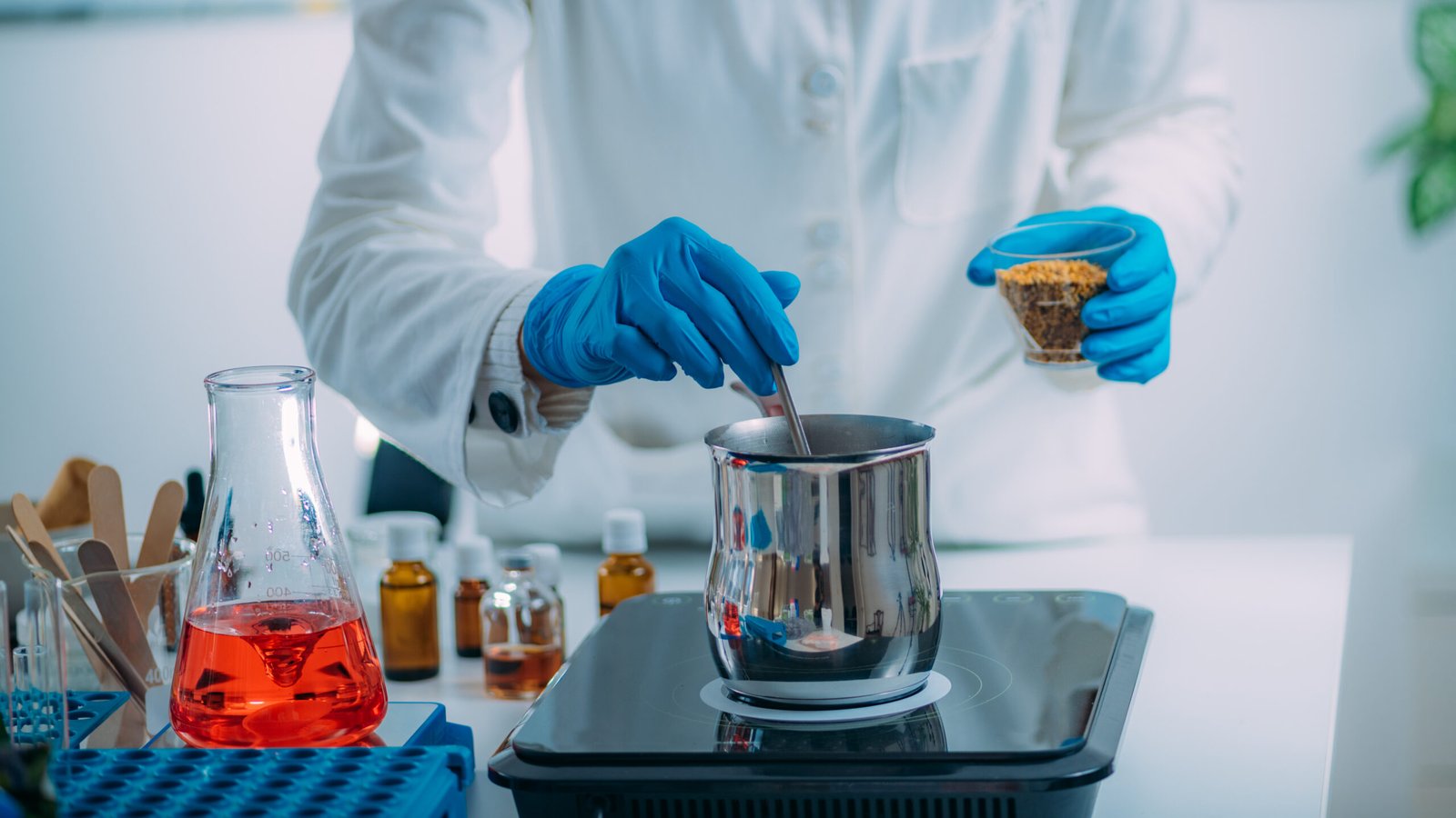 Woman Preparing Cosmetic Beauty Cream in Lab Woman Preparing Cosmetic Beauty Cream in Lab